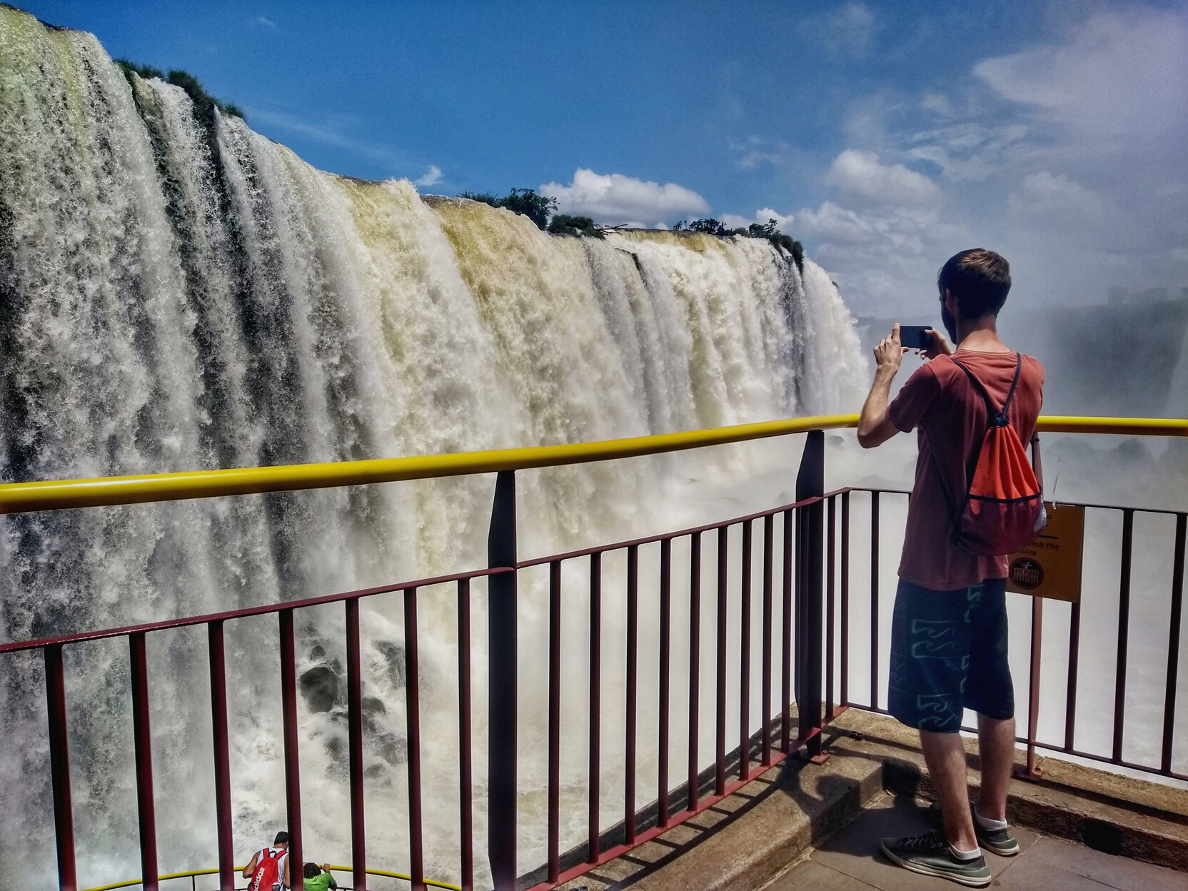 Man at Iguazu Falls - Foz do Iguaçu, Paraná, Brazil